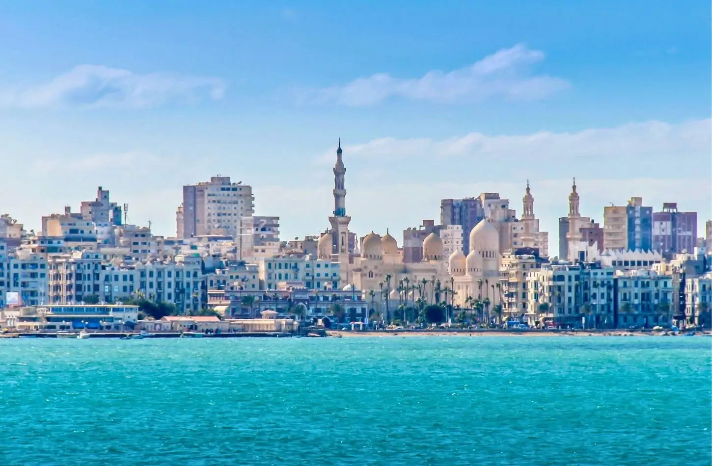 A scenic view of the Abu al-Abbas al-Mursi Mosque on the Alexandria waterfront, featured in an Alexandria Travel Guide.