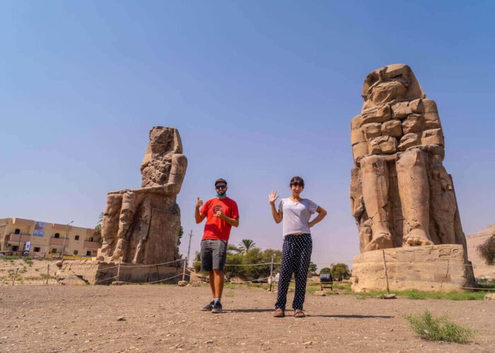 A picture of a couple from their visit to the two statues of Memnon in Luxor