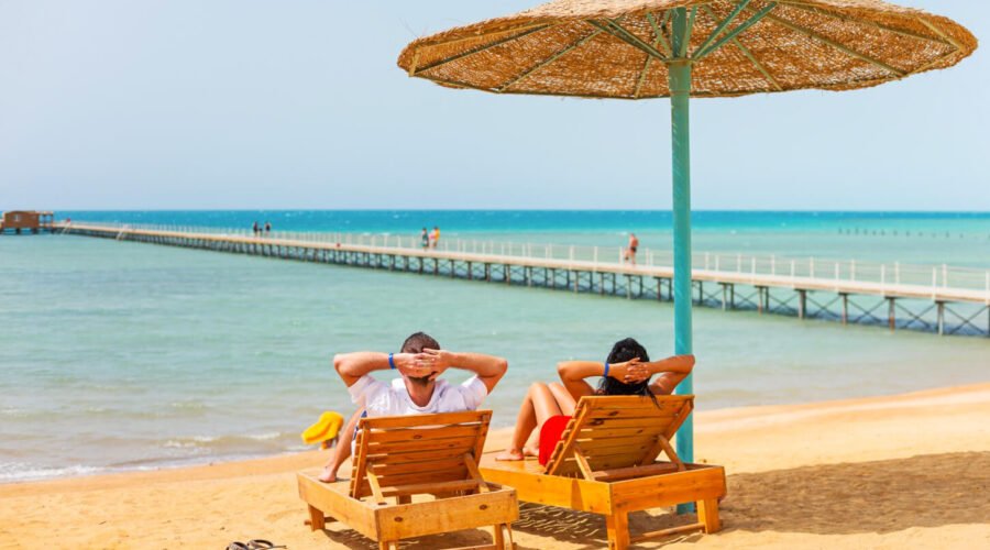 A wonderful picture of a couple sitting on one of the beaches of the Red Sea