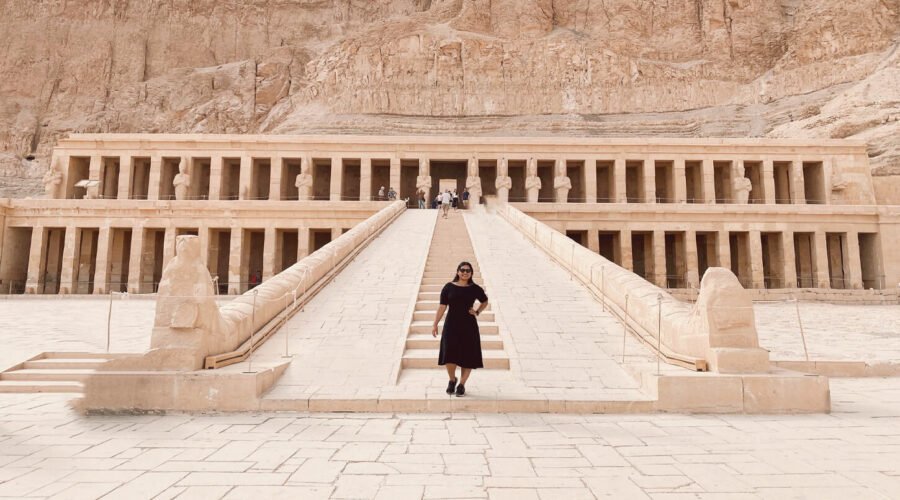 A wonderful picture of a girl in front of the Temple of Queen Hatshepsut