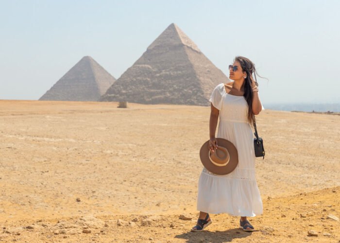 A wonderful picture of a tourist in front of the pyramids