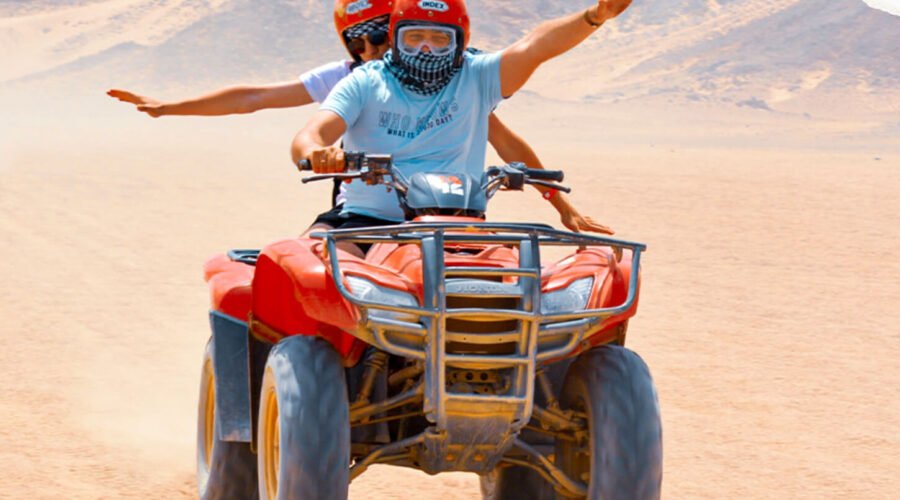 A wonderful shot of two people riding a quad bike from one of the safari trips in Hurghada