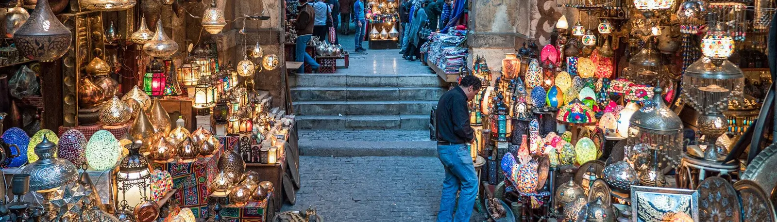 Vibrant stall displaying handmade metal lamps and traditional Egypt souvenirs in Khan el-Khalili bazaar, Cairo