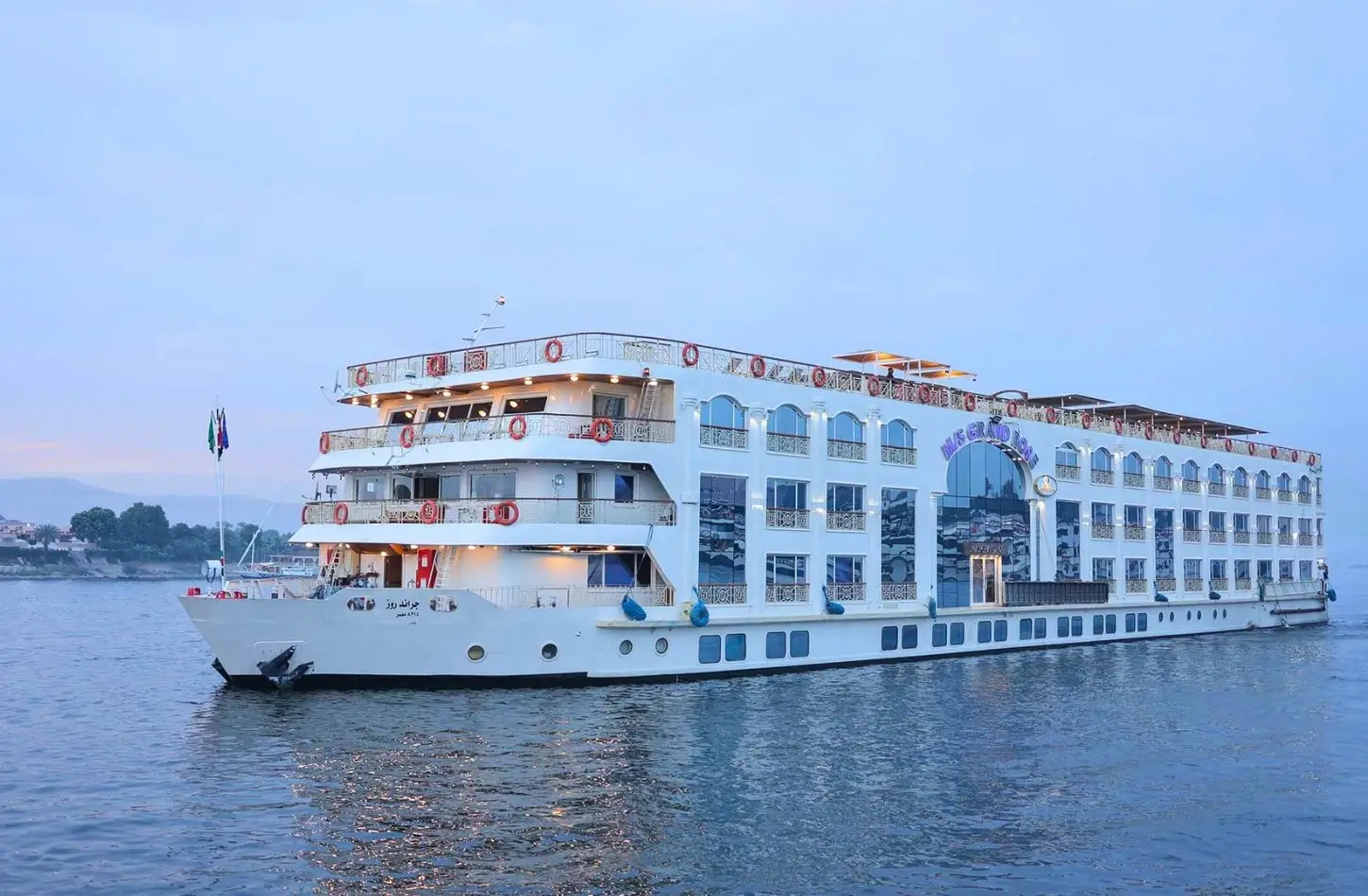 The H/S Sun Goddess, a luxury river boat, sails along the river at sunset, prompting many travelers to wonder: Is a Nile cruise worth it for experiencing Egypt's historic landmarks from the water?
