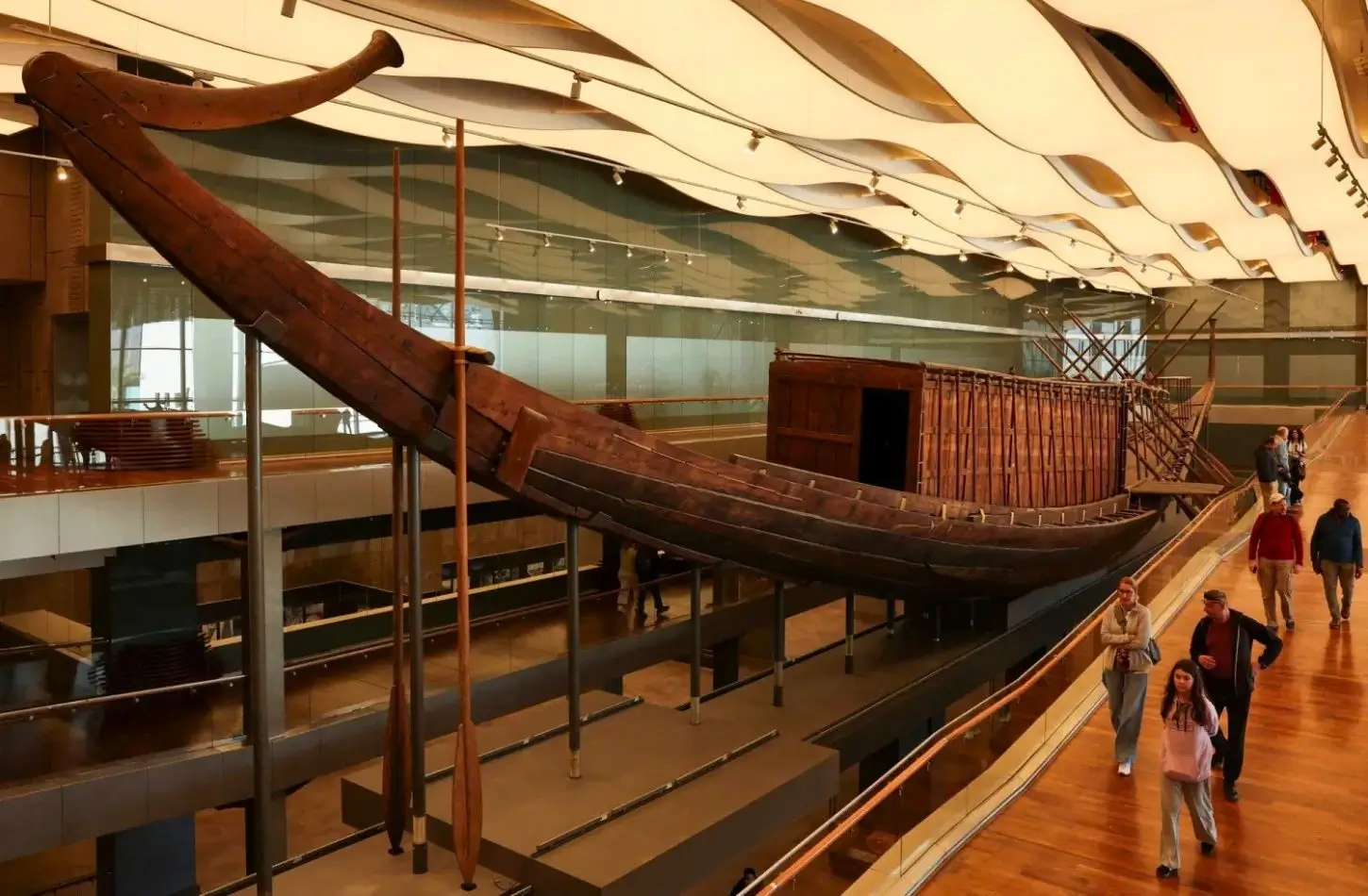 The ancient Khufu Solar Ship is exhibited inside a spacious hall at the Grand Egyptian Museum.