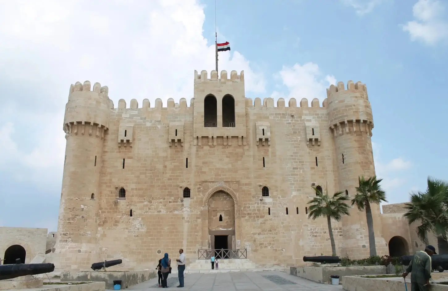 The massive stone entrance and defensive towers of the Citadel of Qaitbay in Alexandria, a perfect coastal stop to feature in your Egypt itinerary 10 days.
