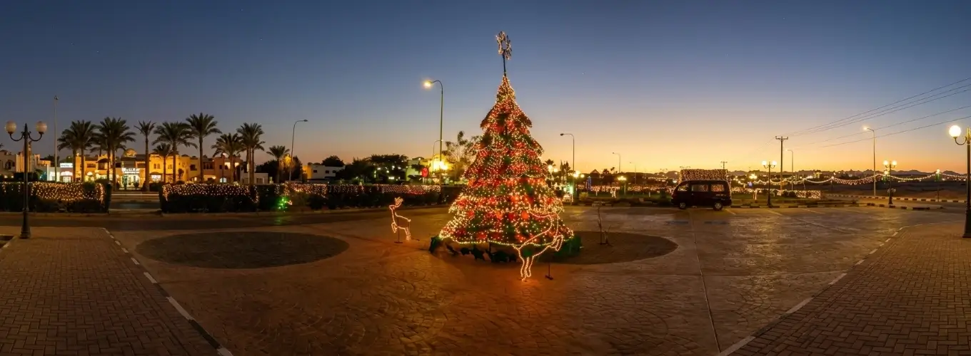 egypt-christmas-tours-illuminated-tree Beautifully illuminated Christmas tree at dusk during Egypt Christmas Tours in a resort square