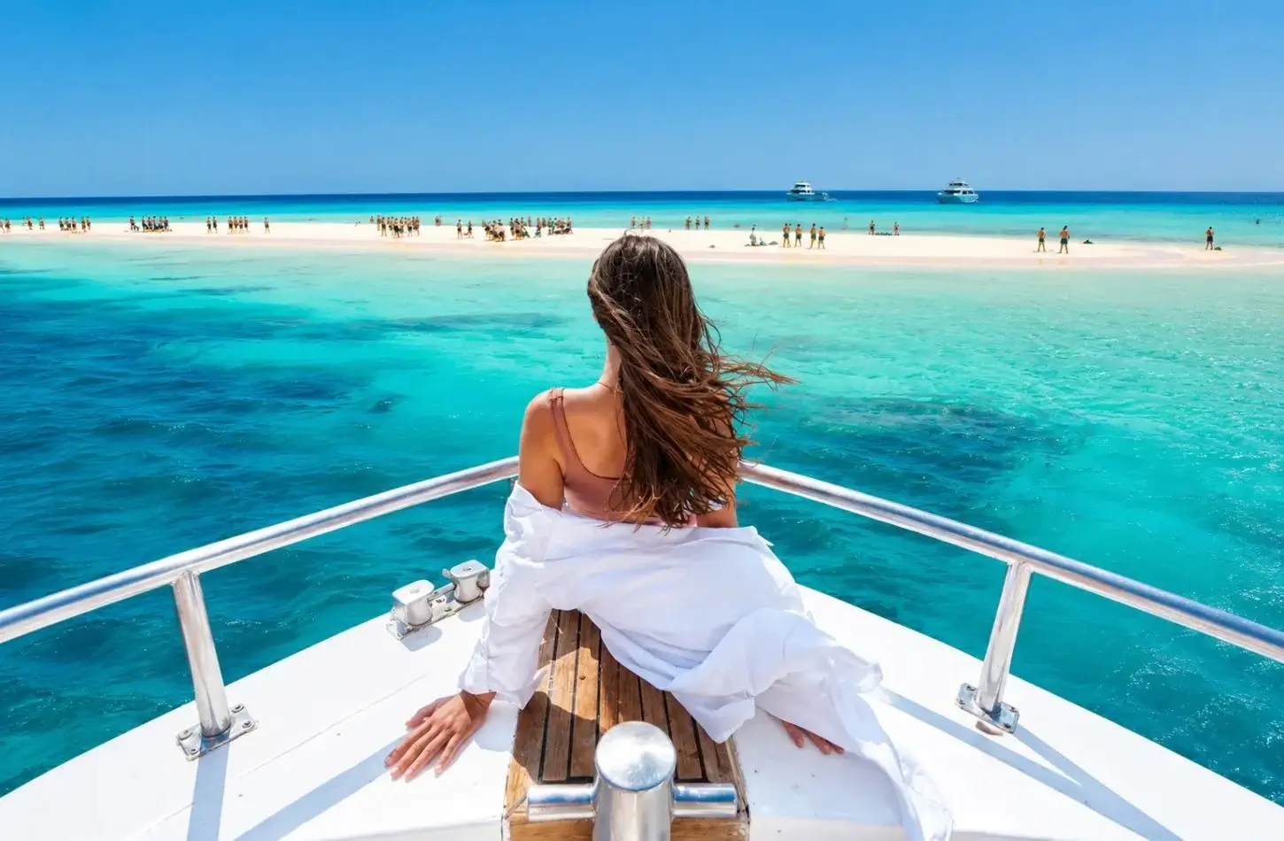 Woman enjoying a sunny boat tour in Hurghada during a trip to Egypt in March.